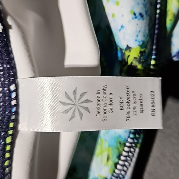 Athleta Athletic Shorts featuring vibrant colors w signature zipper on back. - Picture 6 of 8